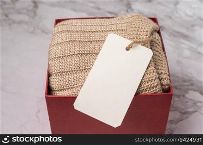 brown sweater in the red gift box