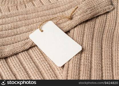 brown sweater with clear tag
