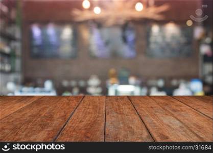 Brown table top with blurred coffee shop interior for background