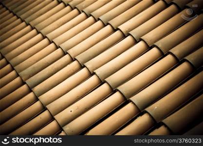 Brown tiles roof texture architecture background, detail of house close up