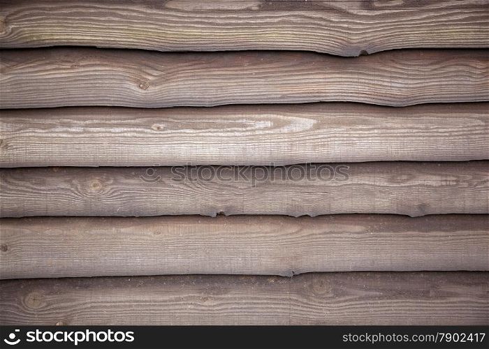 brown varnished planks on outside wall of barn on farm