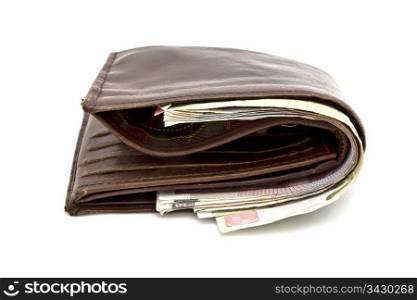 Brown wallet and currency closeup on white background
