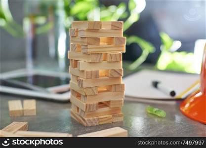 Brown wood building block tower with blur background .Selected focusing .