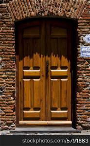 brown wood old door in the centre of colonia del sacramento uruguay