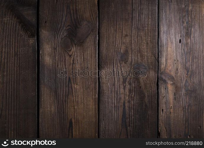 brown wooden background from old boards with cracks and knots