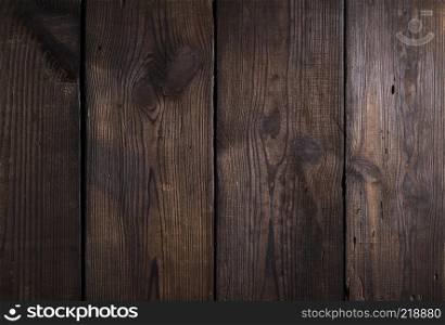 brown wooden background from old boards with cracks and knots