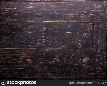 Brown wooden background made of old planks. Brown wooden background