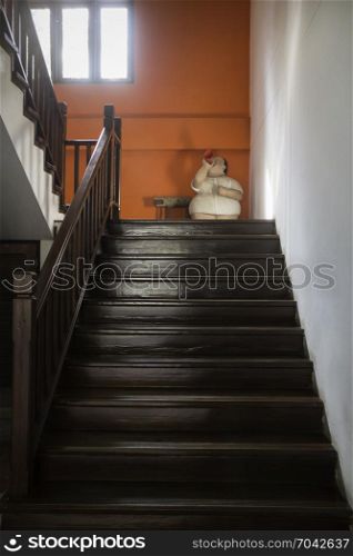 Brown wooden staircase with window light, stock photo