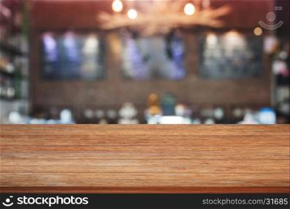 Brown wooden table top with blurred cafe background. product display template