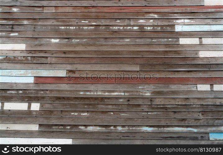 Brown wooden wall texture background. Empty old wood plank surface texture background. Timber wooden wall with brown, blue, and white colors. Exterior design. Wooden wall with nails. Weathered wood.