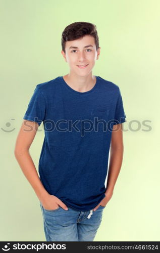 Brown young caucasian boy on green background