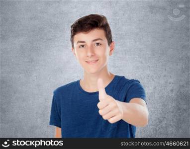 Brown young caucasian boy on grey background