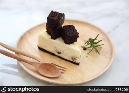 Brownie cheese cake on wood plate