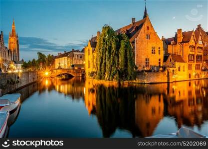 Bruges (Brugge) cityscape with water canal at night, Flanders, Belgium
