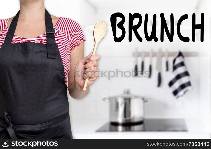 brunch cook holding wooden spoon background.. brunch cook holding wooden spoon background