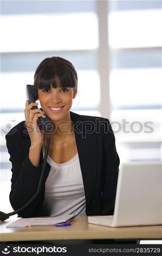 Brunette answering the office phone