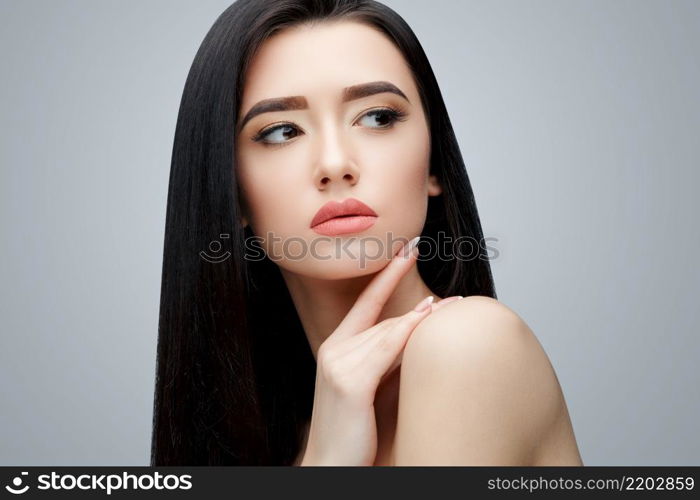 Brunette asian girl with long straight hair. Studio shot. Brunette asian girl with long straight hair