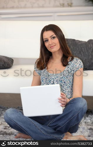 Brunette at home with laptop