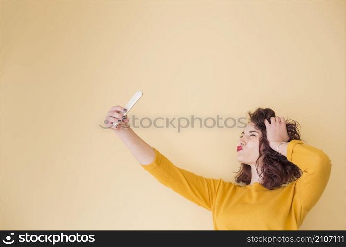 brunette blogger doing selfie