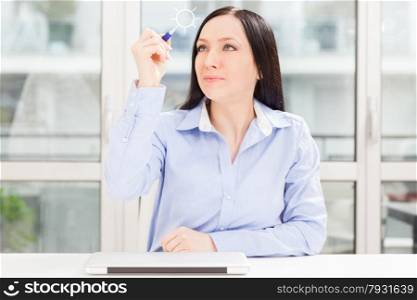 Brunette business woman with notebook working in home office