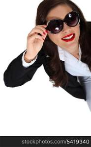 Brunette businesswoman wearing sunglasses