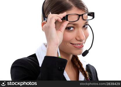 Brunette call-center worker wearing glasses