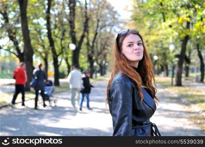 brunette Cute young woman posing outdoors in nature