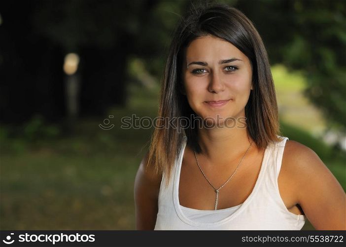 brunette Cute young woman smiling outdoors in nature