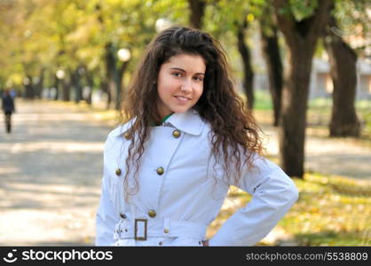 brunette Cute young woman smiling outdoors in nature