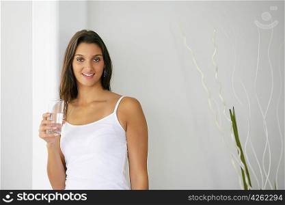 Brunette drinking a glass of water