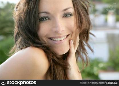 Brunette fashion portrait in outdoors with natural expresion