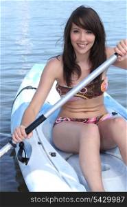 Brunette girl in canoe