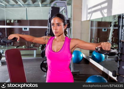 brunette girl plate raise flies fly workout at gym exercise