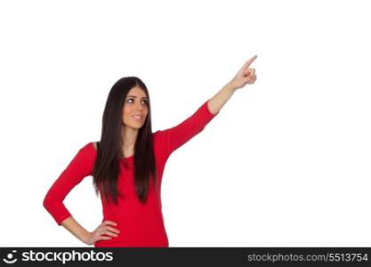 Brunette girl pointing something with her finger isolated on white background