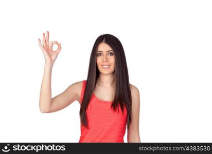 Brunette girl with a red dress saying Ok isolated on white background