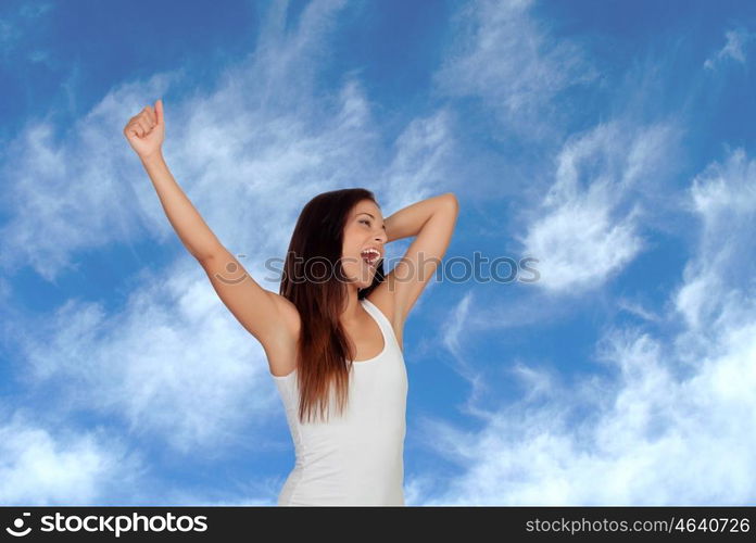 Brunette girl yawning and stretching morning with a blue background of background