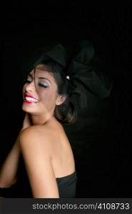 Brunette glamour fashion smiling over black background