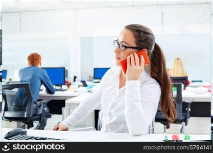Brunette glasses businesswoman working in office talking smartphone