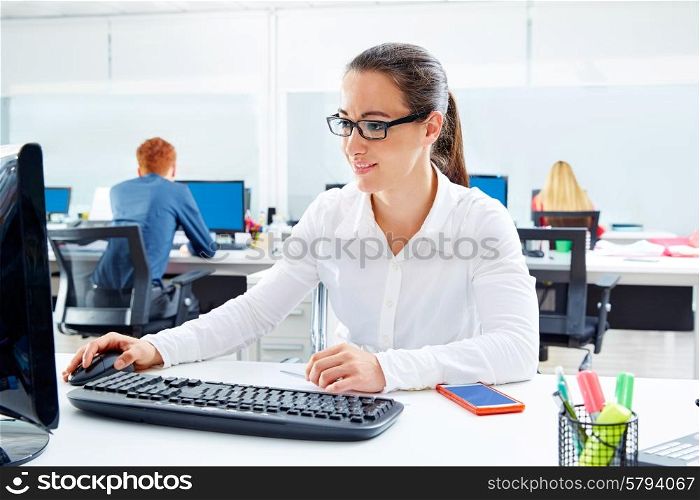 Brunette glasses businesswoman working in office with computer