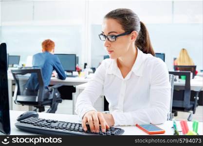 Brunette glasses businesswoman working in office with computer