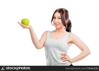 brunette holding a green apple in the palm of your hand