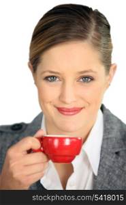 Brunette holding cup of espresso