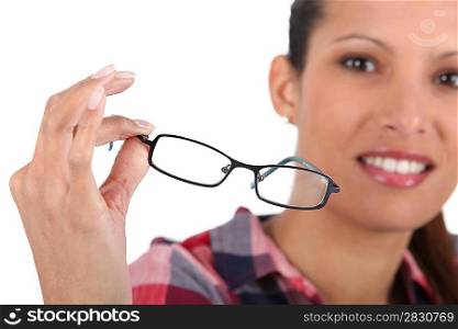Brunette holding glasses