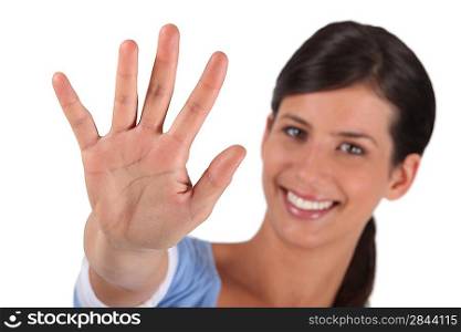 Brunette holding hand in stop gesture