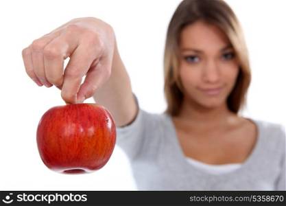 Brunette holding red apple