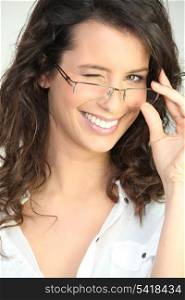 Brunette in glasses winking at the camera
