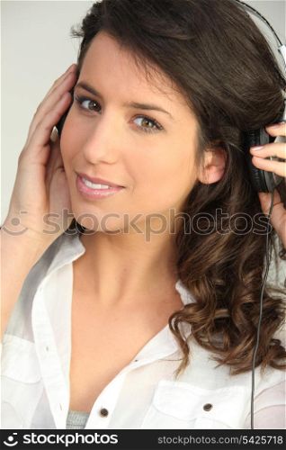 Brunette listening to music