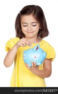 Brunette little girl with a blue moneybox isolated on a over white background