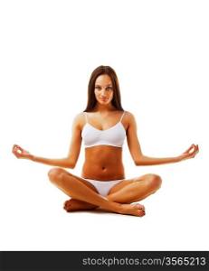 Brunette model in yoga pose on white background
