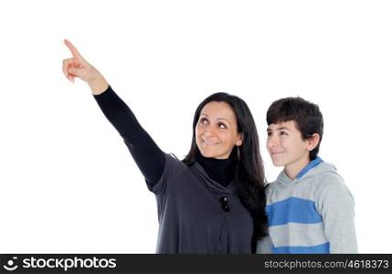 Brunette mother showing something at his teenager son isolated on a white background